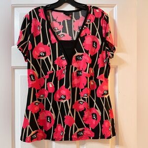 East 5th Black Top with beautiful flowers.